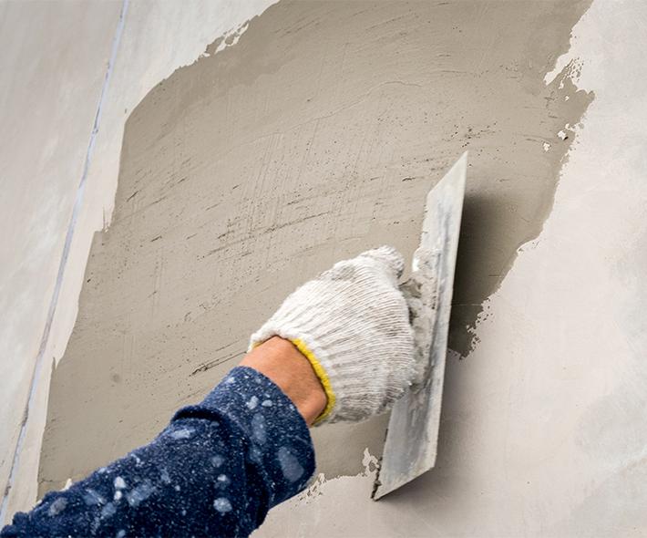 Man Plastering a Wall